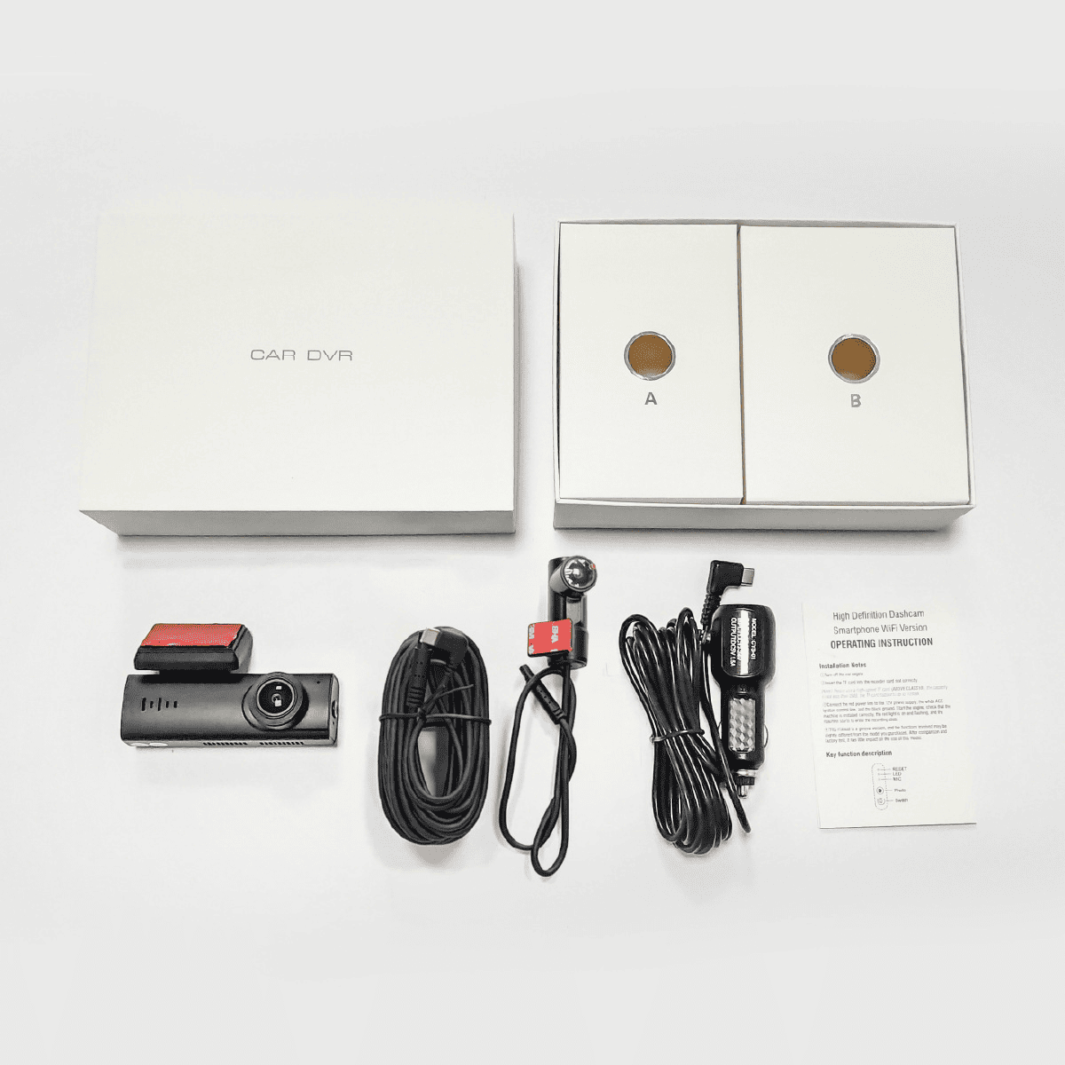 Full package contents of A207 Dash Cam: includes front and rear cameras, power cables, charger, mounts, and instruction manual.
