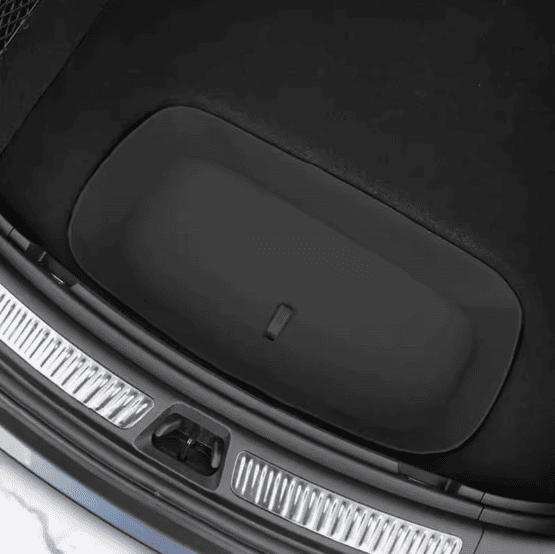 Top view of the closed trunk storage lid in a BYD Sealion 7, showing seamless integration with the rear cargo area
