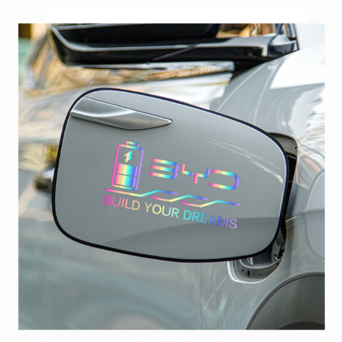 Holographic BYD charging port decal installed on EV, featuring battery icon and Build Your Dreams slogan