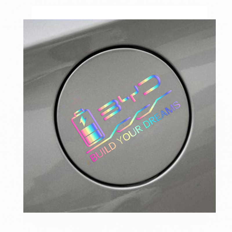 Installed iridescent BYD charging port decal on car, featuring battery icon and Build Your Dreams slogan