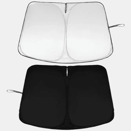 Foldable windshield sunshade for BYD Atto 3 showing front silver reflective side and back black thermal layer