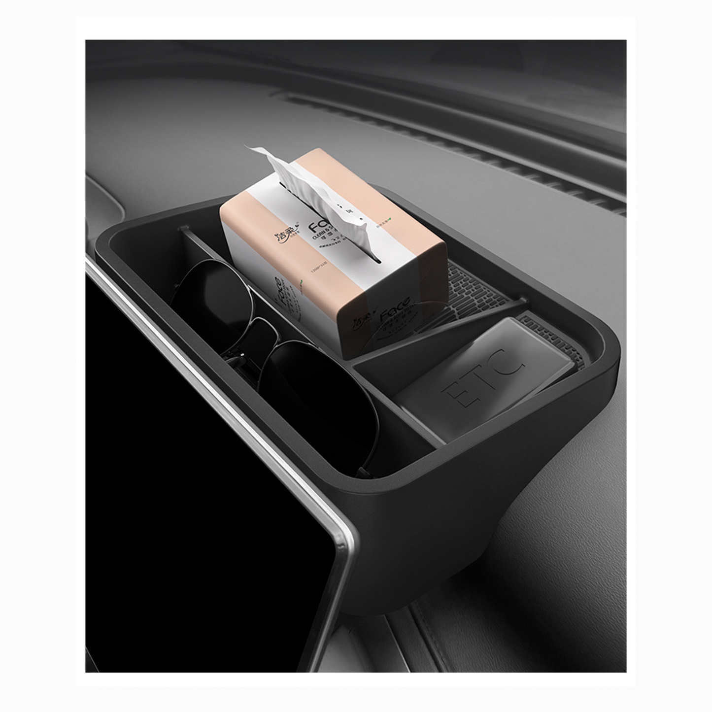 BYD ATTO 3 hidden storage box installed behind touchscreen, shown storing tissues, sunglasses and ETC card