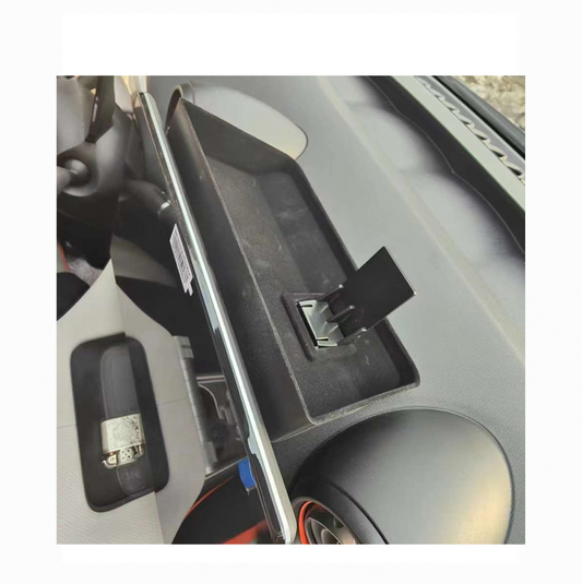 Close-up view of rear dashboard storage tray installed in BYD Dolphin, showing custom-fit design for organizing small items.
