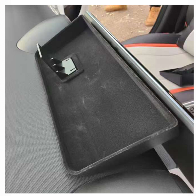 Rear dashboard storage tray installed in BYD Dolphin interior, shown with soft lining and open compartment for storing essentials.