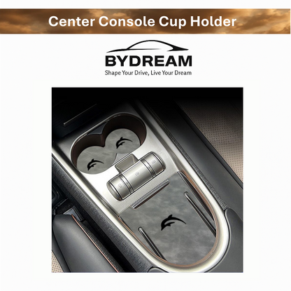 Close-up of BYD Dolphin center console showing custom-fit silicone cup holder mat with dolphin logo, waterproof and dustproof for clean car interior.