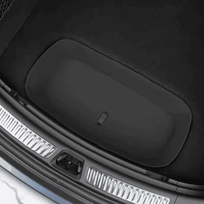 Top view of the closed trunk storage lid in a BYD Sealion 7, showing seamless integration with the rear cargo area
