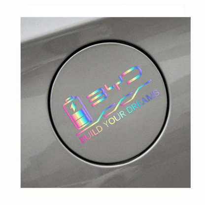 Installed iridescent BYD charging port decal on car, featuring battery icon and Build Your Dreams slogan
