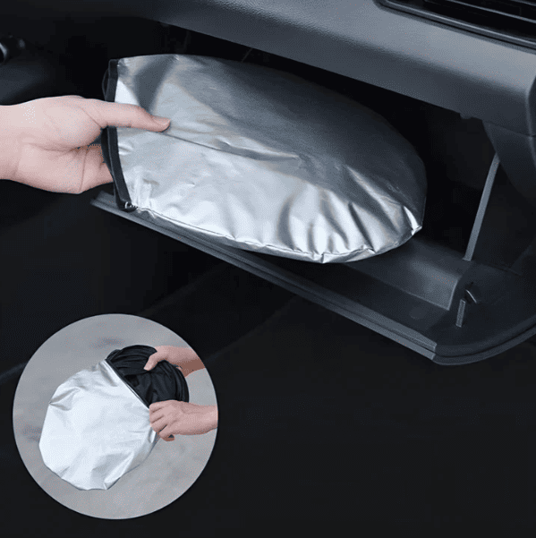 Foldable BYD windshield sunshade showing waterproof and heat-insulating material stored in glovebox