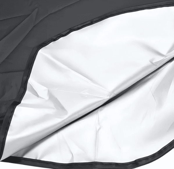Close-up of BYD windshield sunshade showing rearview mirror cutout and reflective inner layer for UV protection