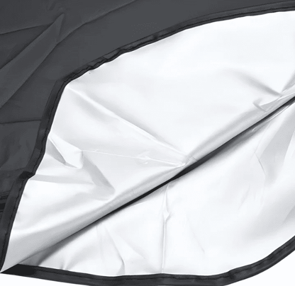 Close-up of BYD windshield sunshade showing rearview mirror cutout and reflective inner layer for UV protection