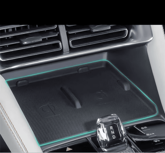 Close-up installation of silicone wireless charging pad in BYD Sealion 6, protecting the charging panel and enhancing anti-slip grip

