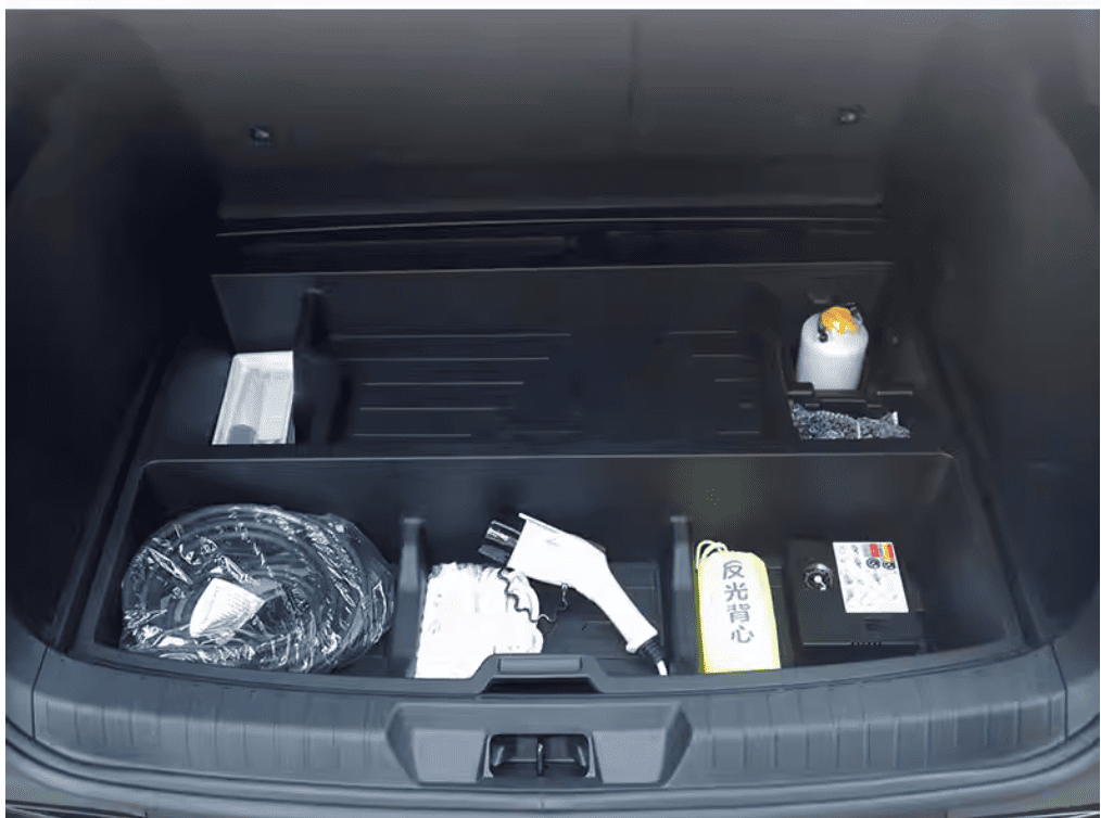 BYD Sealion 6 underfloor trunk organizer shown fully loaded with EV cables, safety kit, and accessories for real-life storage demonstration

