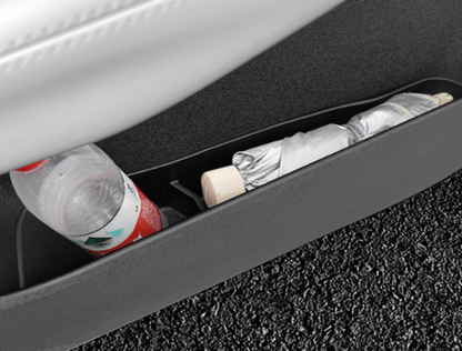 BYD ATTO 1 door pocket organizer insert with divider compartments holding a water bottle and umbrella, showing practical door bin storage and tidy interior organisation (Australia)
