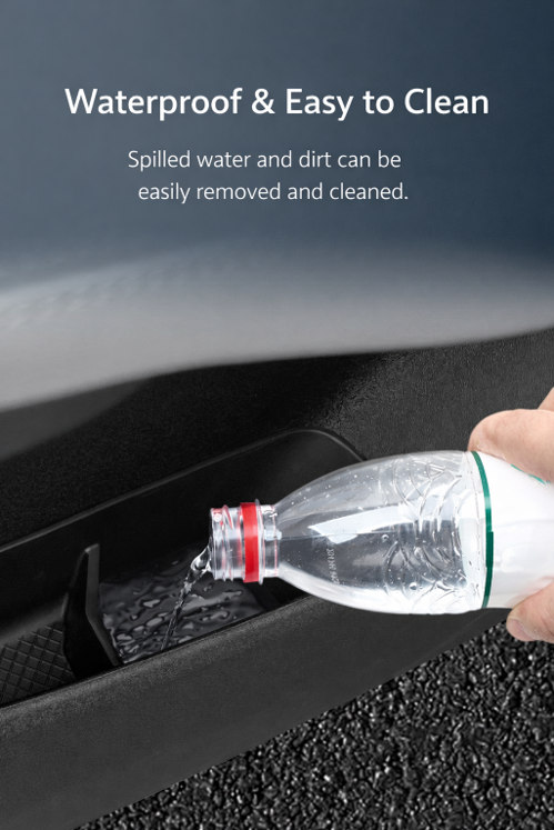 Water poured into BYD ATTO 1 door pocket organizer insert to show waterproof, easy-to-clean door bin divider tray for interior storage (Australia)