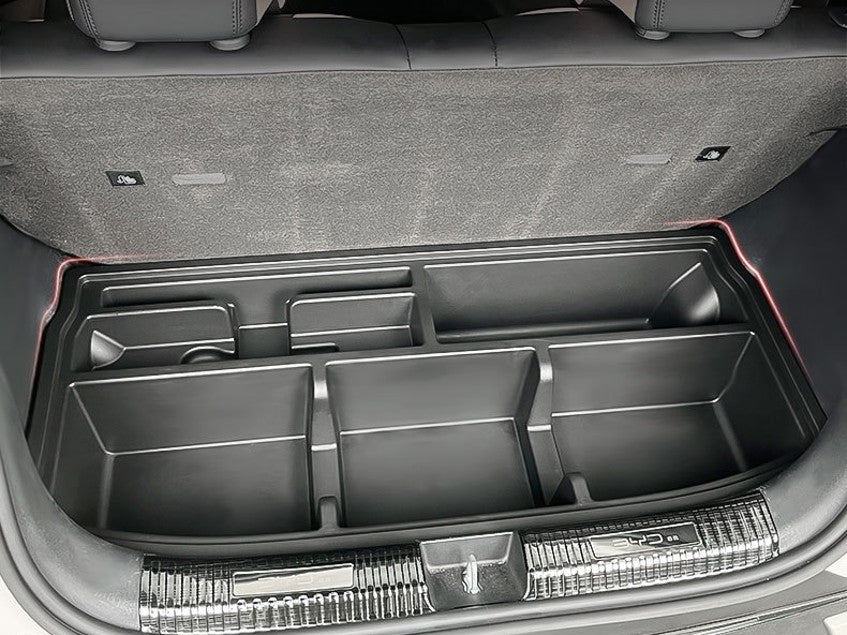 BYD ATTO 1 custom-fit trunk boot organizer tray in black ABS plastic with multiple compartments to separate tools, groceries and accessories; space-saving storage insert keeps the boot tidy and prevents items sliding (BYDREAM).