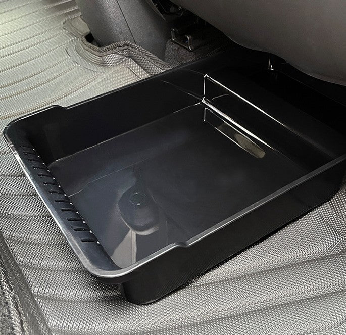 Black under seat storage box installed under the rear seat of BYD ATTO 1, custom fit hidden seat gap organizer showing interior details, BYDream