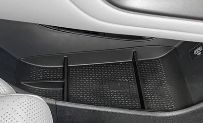 Installed BYD ATTO 2 (2025+) centre console lower storage organiser tray insert, showing divided compartments and anti-slip textured TPE surface for keeping small items neatly organised.