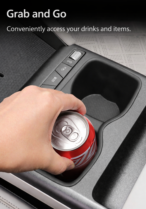 Hand placing a drink can into the BYD ATTO 2 (2025+) centre console cup holder with a non-slip insert liner for easy grab-and-go access and spill protection.
