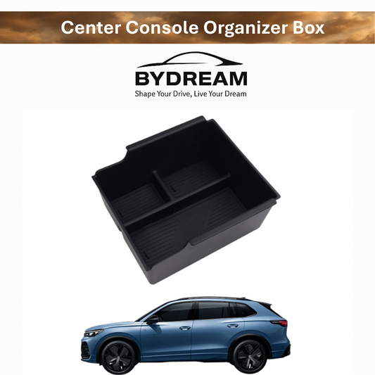 Center console organizer box for BYD ATTO 3, black plastic tray with divided compartments, shown above a blue BYD SUV.
