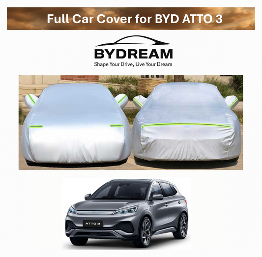 Full car cover for BYD ATTO 3 shown in silver with thick waterproof oxford fabric, protecting vehicle from rain, sun, and dust.