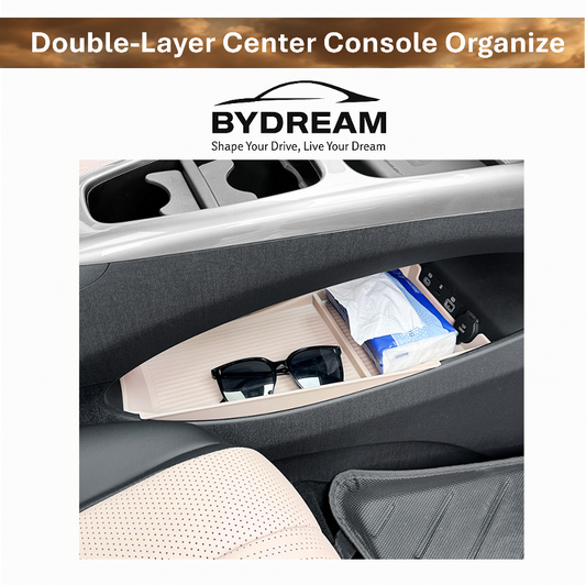 Double-layer center console organizer tray installed in BYD Dolphin, showing neatly stored sunglasses and tissue box in the car interior storage compartment.
