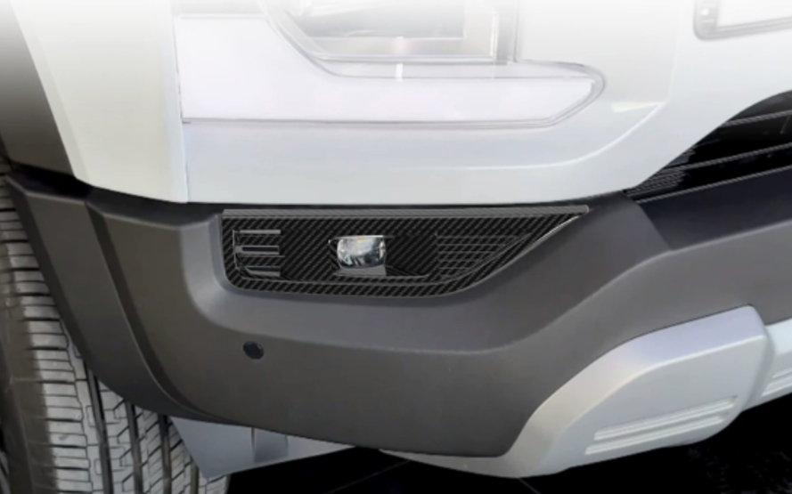 Carbon fiber style fog light trim cover installed on BYD Shark 6 front bumper