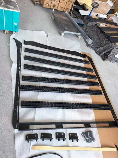 Unassembled BYD Shark 6 roof rack kit with aluminum crossbars and steel side frames. Includes mounting brackets and bolts. Ready for installation.