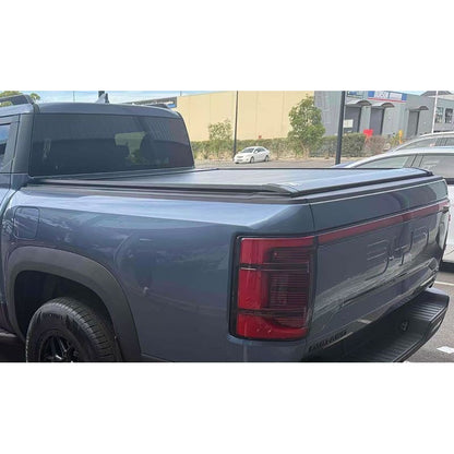 BYDREAM aluminum retractable tonneau cover for BYD Shark 6, outdoor rear view installed on blue-gray pickup