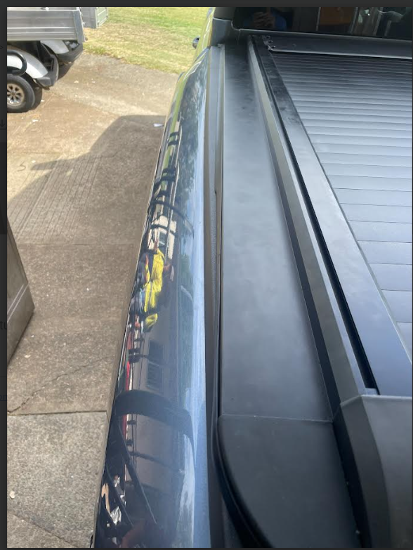 `Left side rail close-up of BYDREAM aluminum retractable tonneau cover, custom fit for BYD Shark 6 truck bed`