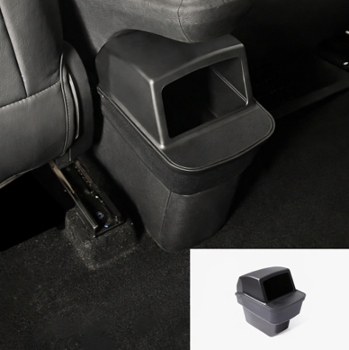 BYDREAM rear seat trash bin installed in the back seat area of BYD ATTO 1, showing a custom-fit car rubbish bin behind the centre console with an inset product view.