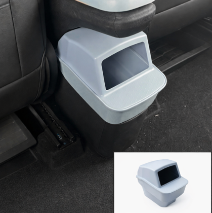 Light blue BYDREAM rear seat trash bin installed behind the centre console in a BYD ATTO 1, showing a custom-fit car rubbish bin with an inset product image.