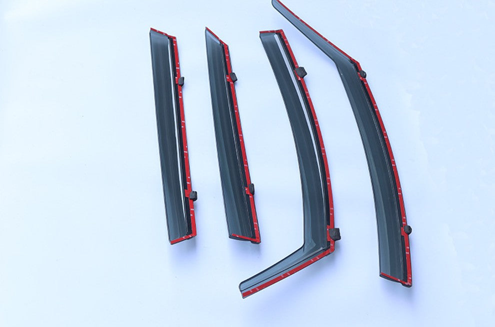 4-piece smoke-tint window visor/rain guard set for :contentReference[oaicite:0]{index=0} ATTO 2 (2025+), wind deflectors shown with red adhesive tape backing for easy stick-on installation.