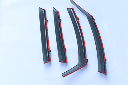 4-piece smoke-tint window visor/rain guard set for :contentReference[oaicite:0]{index=0} ATTO 2 (2025+), wind deflectors shown with red adhesive tape backing for easy stick-on installation.