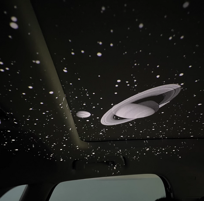 Car USB starlight projector displaying Saturn pattern on interior ceiling, creating ambient galaxy effect for night driving and car decoration.