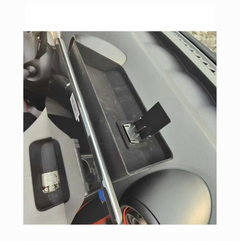 Close-up view of rear dashboard storage tray installed in BYD Dolphin, showing custom-fit design for organizing small items.