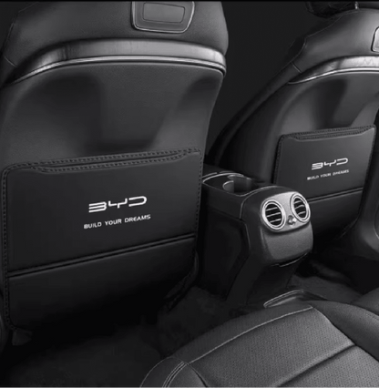 Rear seat view of installed kick pads in BYD Sealion 6 with BYD logo and center air vents visible


